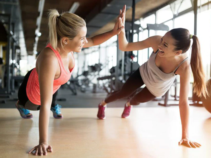 beautiful women working out in a gym